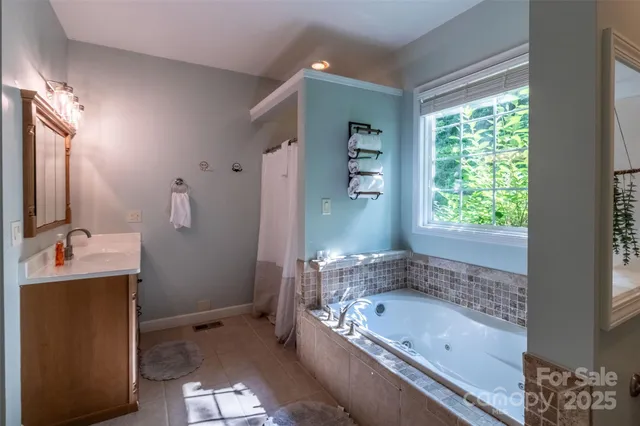 a bathroom with a bathtub and a sink