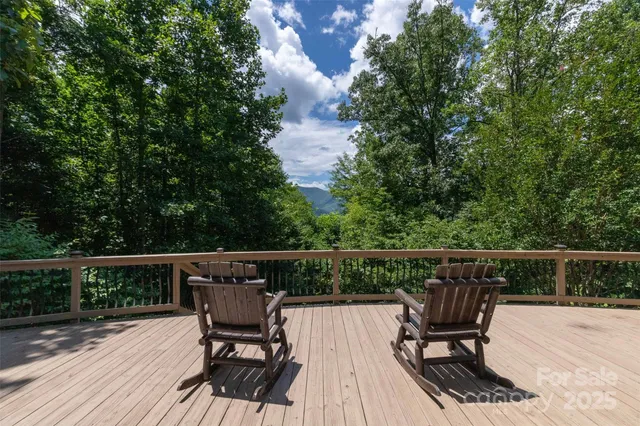 a view of balcony with furniture and wooden floor