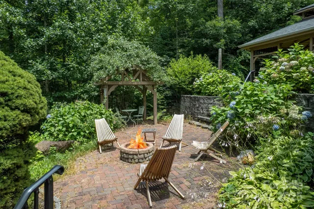 a view of backyard with furniture and garden