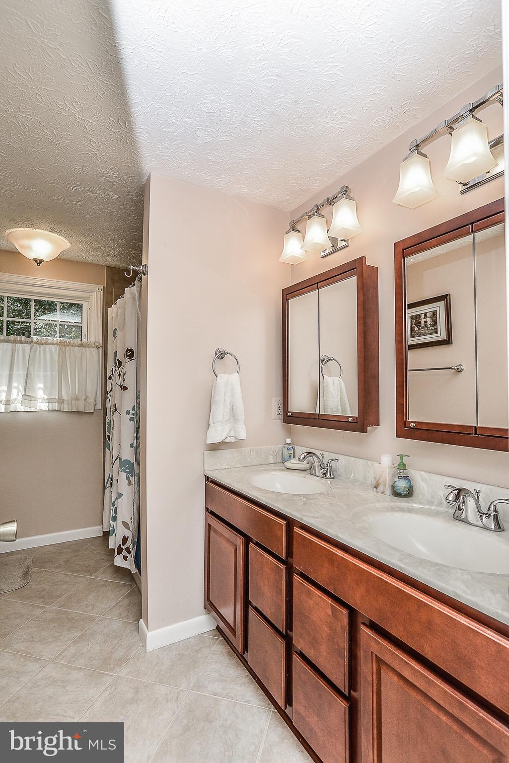 8457 Rushing Creek Court Springfield, VA 22153 - Photo 13 of 28 Remodeled hall bath