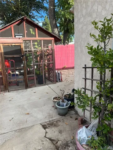 a view of a chairs and table in a patio