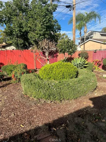 a view of a backyard with swimming pool