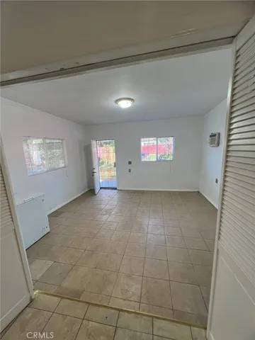 a view of an empty room and window