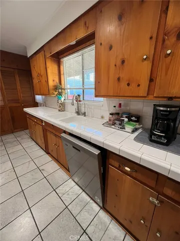 a kitchen with a sink and cabinets