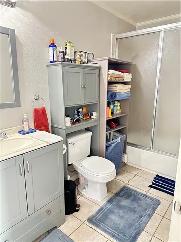 a bathroom with a sink toilet and a shower