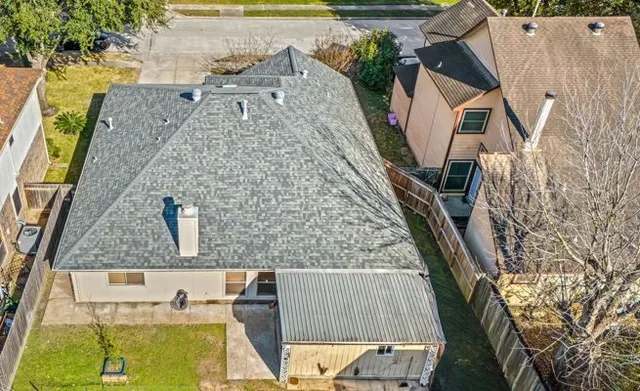 an aerial view of a house with swimming pool