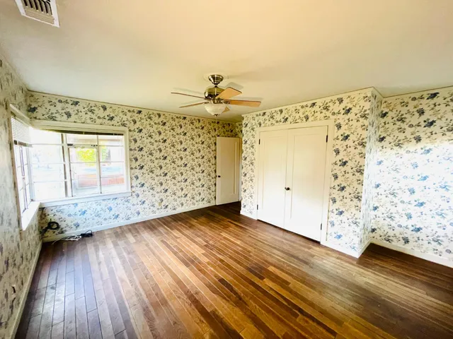 a view of a livingroom with wooden floor