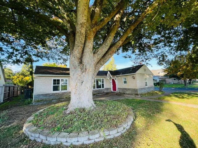 a house view with a garden space