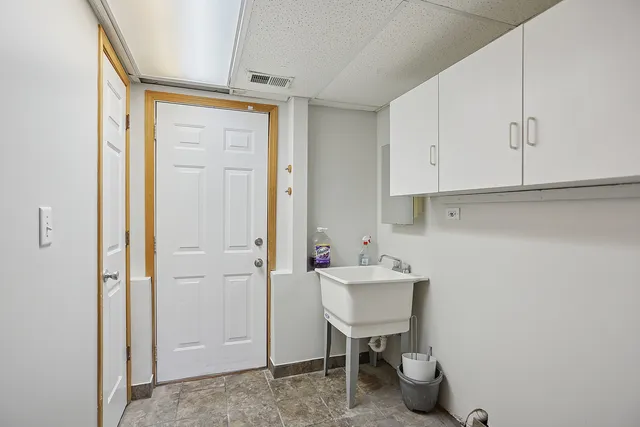 a view of a storage and utility room in a house