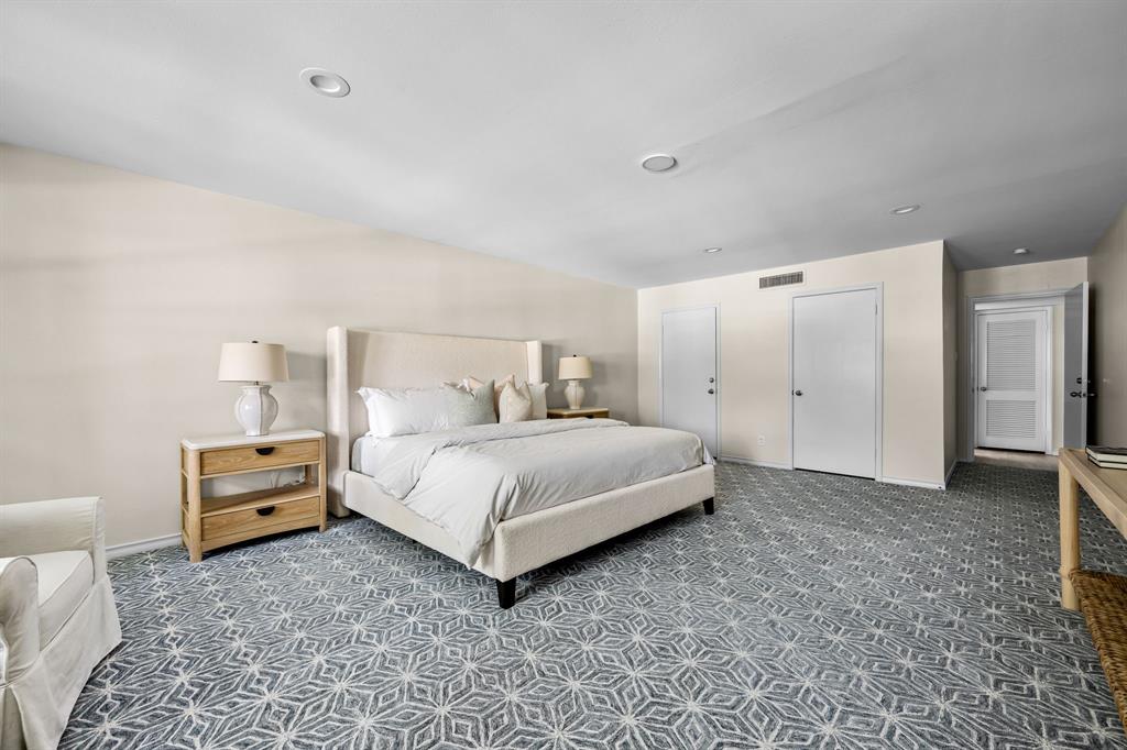 6226 Bandera Avenue, Unit C Dallas, TX 75225 - Photo 12 of 19 a bedroom with a bed and closet