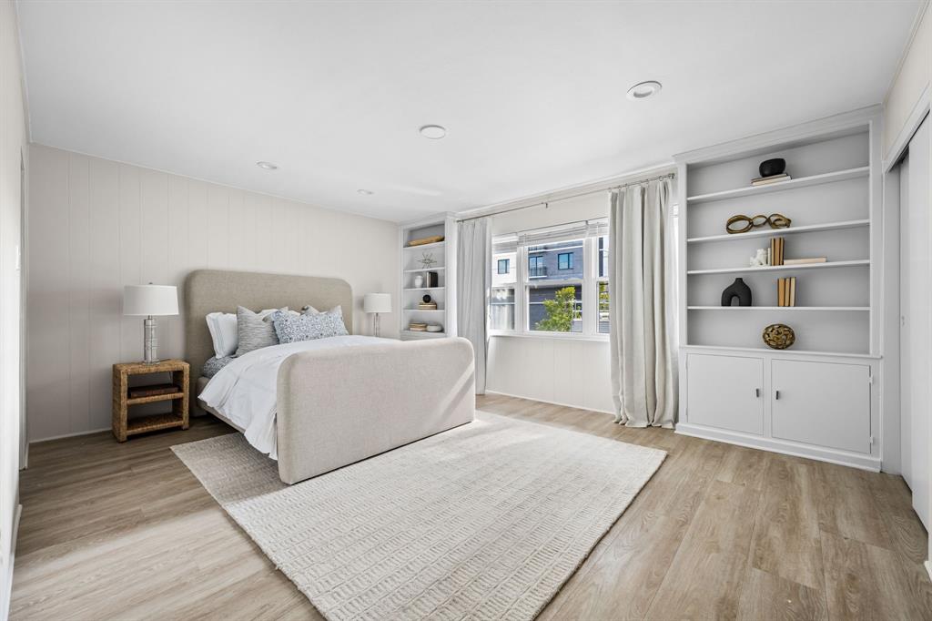 6226 Bandera Avenue, Unit C Dallas, TX 75225 - Photo 15 of 19 a bedroom with a large bed and a window