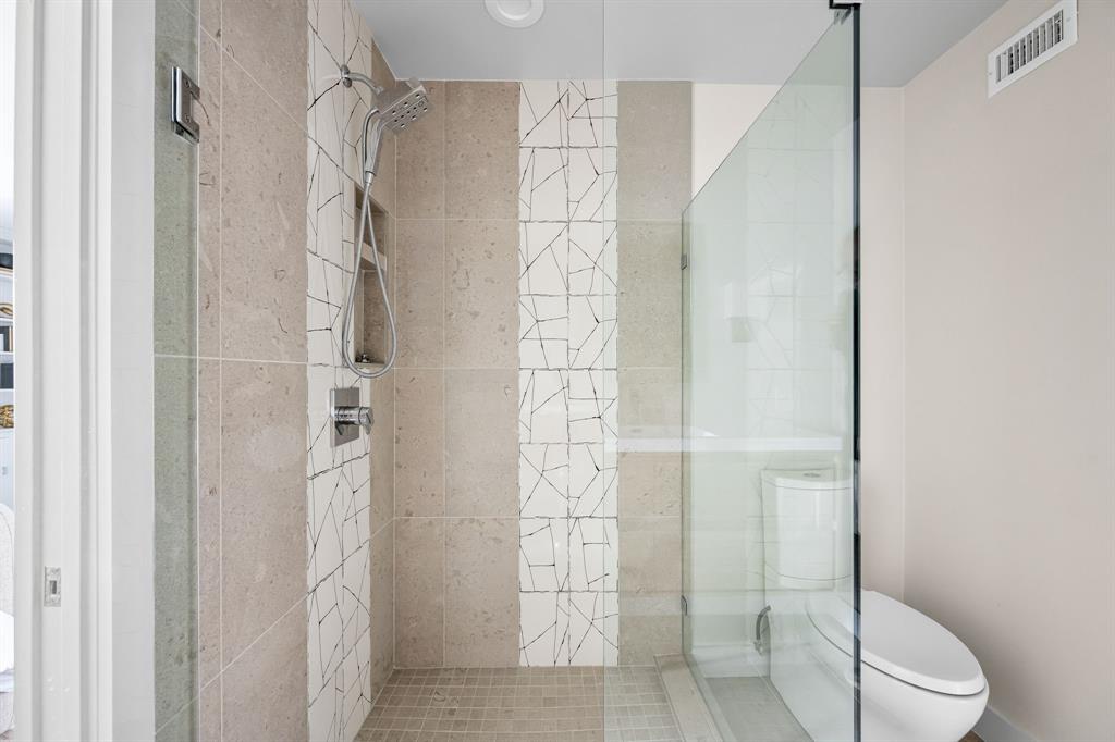 6226 Bandera Avenue, Unit C Dallas, TX 75225 - Photo 17 of 19 a bathroom with a shower and a toilet