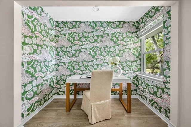 a dining room with furniture and window