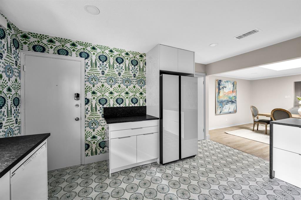 6226 Bandera Avenue, Unit C Dallas, TX 75225 - Photo 9 of 19 a view of a kitchen with furniture and refrigerator