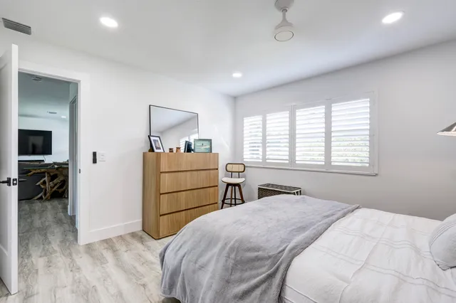 a bedroom with a bed and a closet