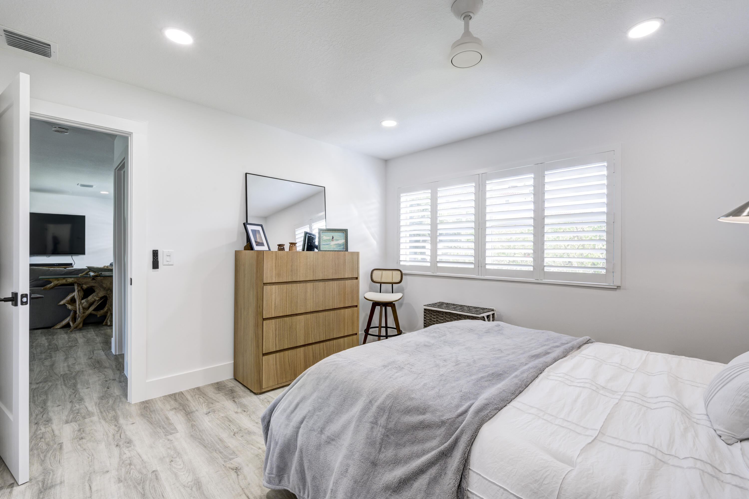 8585 Southeast Palm Street Hobe Sound, FL 33455 - Photo 21 of 43 a bedroom with a bed and a closet