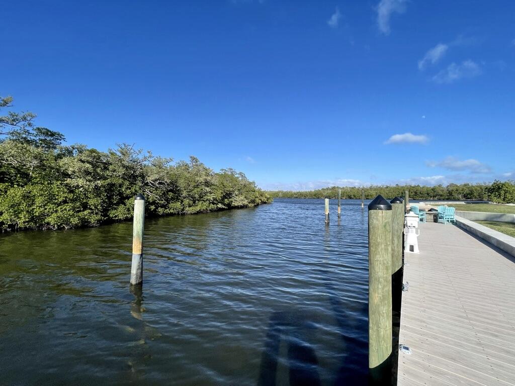 8585 Southeast Palm Street Hobe Sound, FL 33455 - Photo 31 of 43 a view of a lake with houses