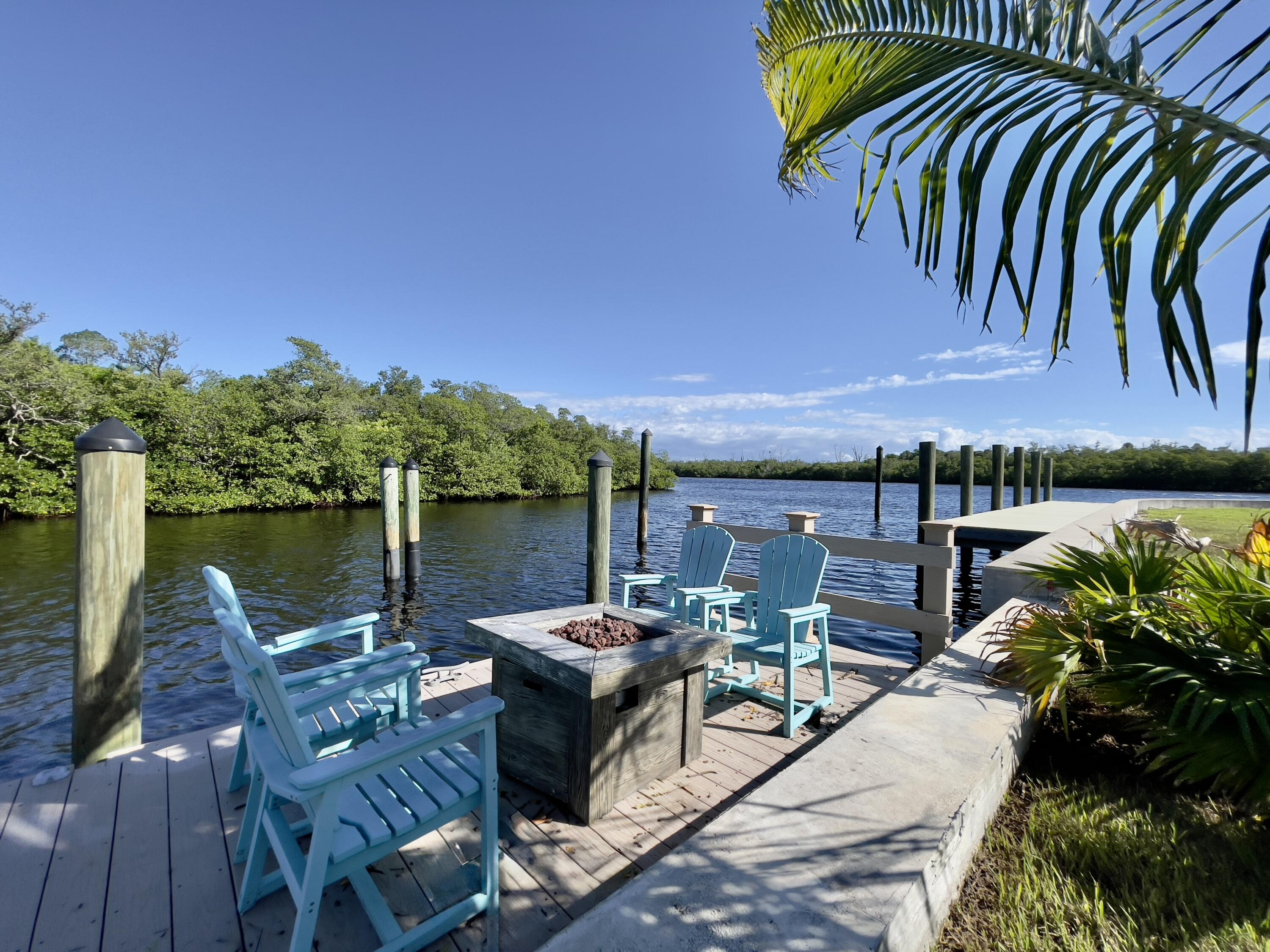 8585 Southeast Palm Street Hobe Sound, FL 33455 - Photo 35 of 43 a view of a chairs and table in patio