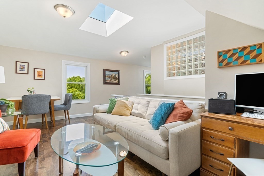 47 R Jamaica Street, Unit 3 Boston, MA 02130 - Photo 1 of 16 a living room with furniture and a flat screen tv