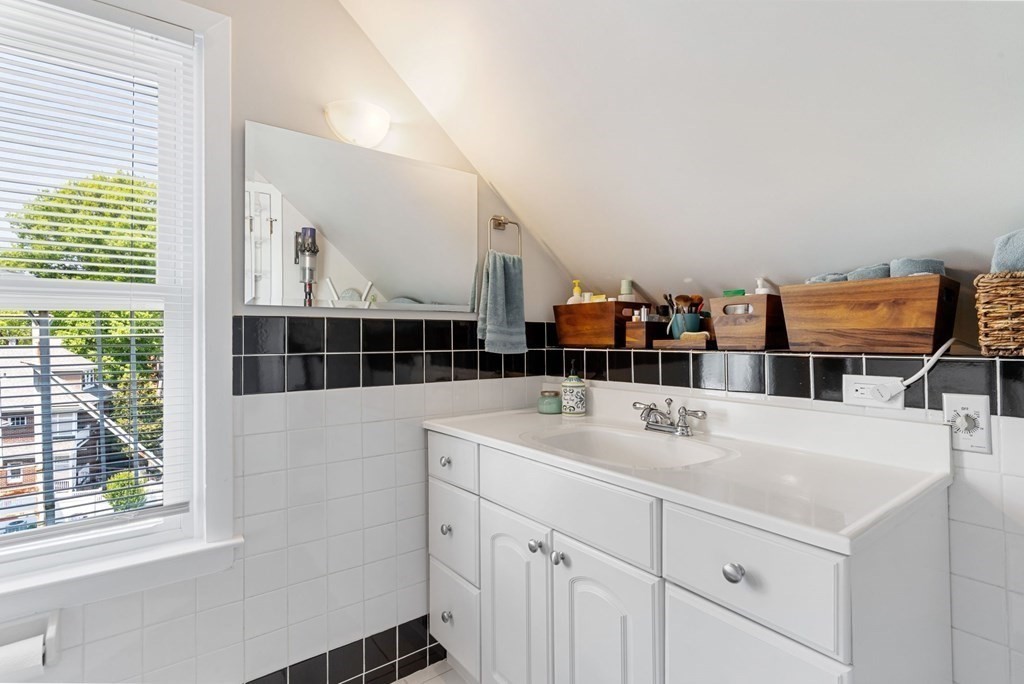 47 R Jamaica Street, Unit 3 Boston, MA 02130 - Photo 13 of 16 a view of a kitchen with a sink and a window