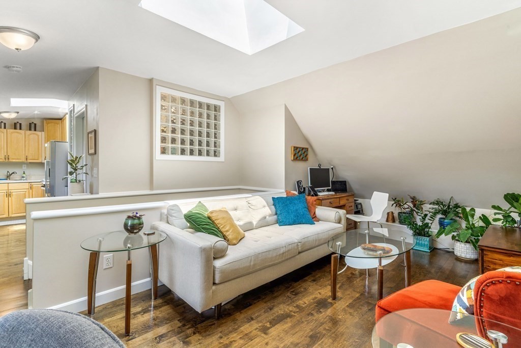 47 R Jamaica Street, Unit 3 Boston, MA 02130 - Photo 2 of 16 a living room with furniture and a potted plant