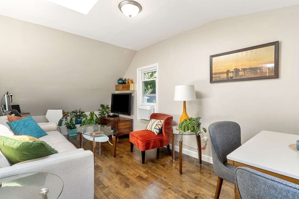 47 R Jamaica Street, Unit 3 Boston, MA 02130 - Photo 3 of 16 a living room with furniture and a flat screen tv