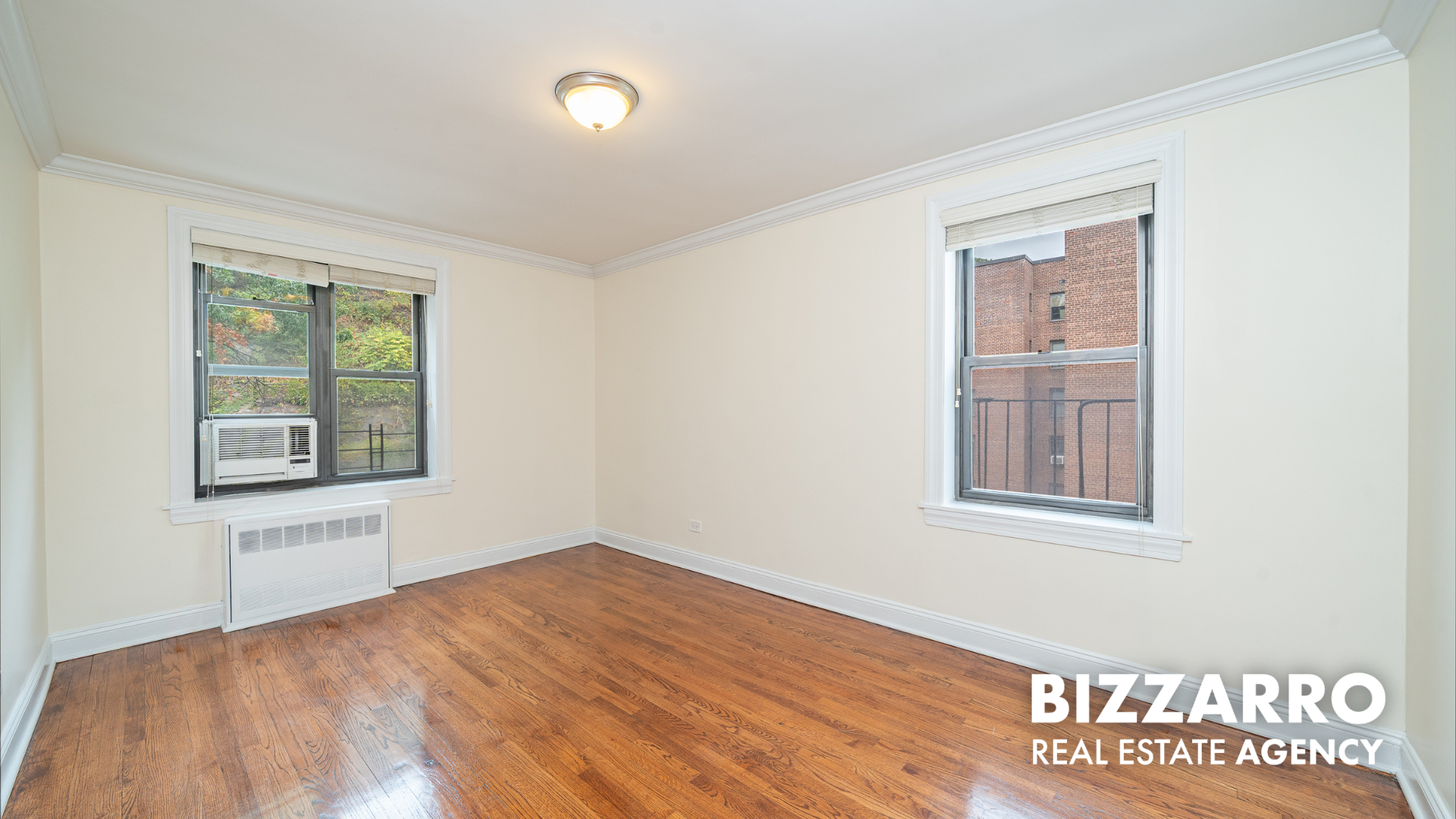 Undisclosed Address Manhattan, NY 10040 - Photo 8 of 10 an empty room with windows