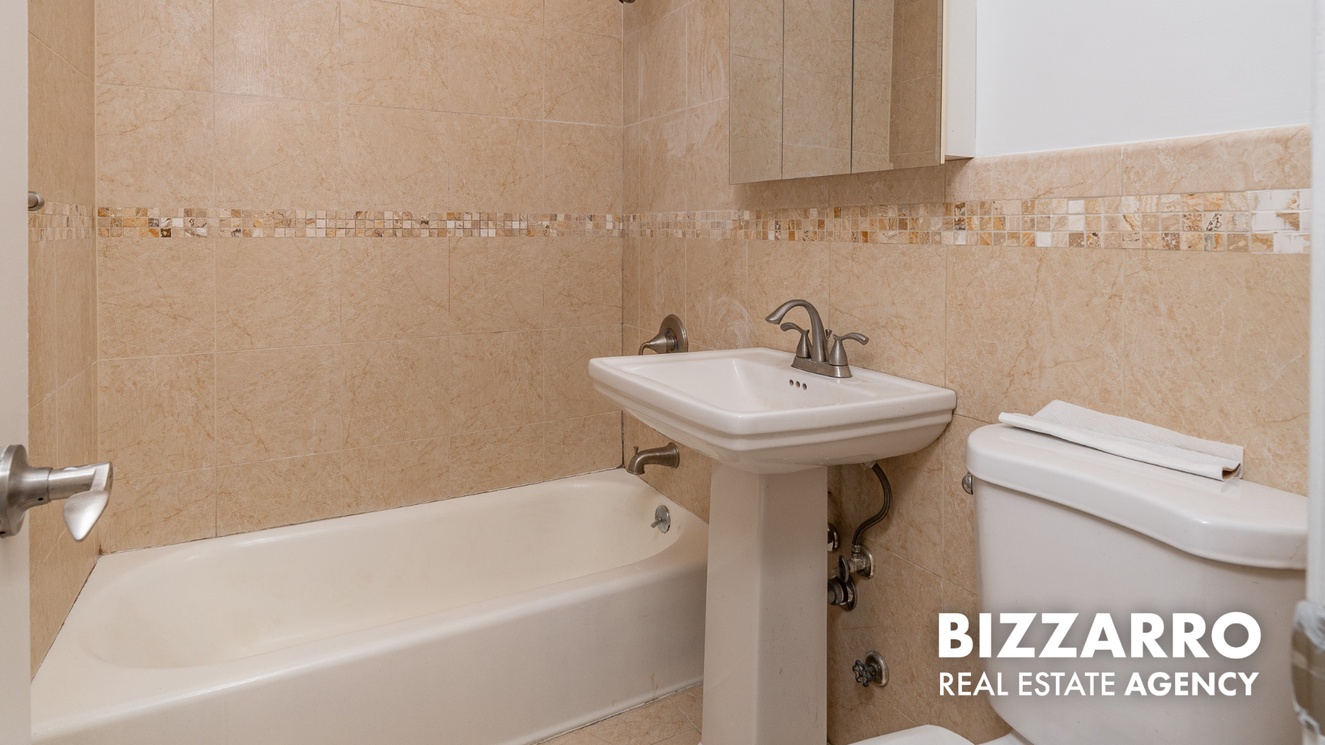 Undisclosed Address Manhattan, NY 10040 - Photo 9 of 10 a bathroom with a sink a toilet and shower