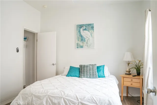 a bedroom with a bed and a table in it