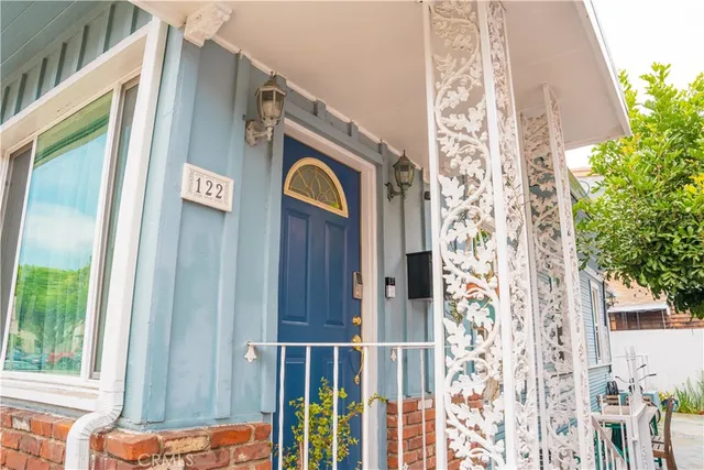 a front view of a house with a door and windows