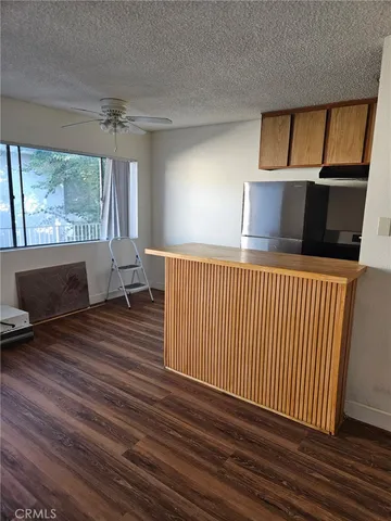a hallway with a couch and a fireplace