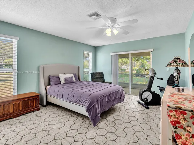 a white toilet next to a bathroom sink
