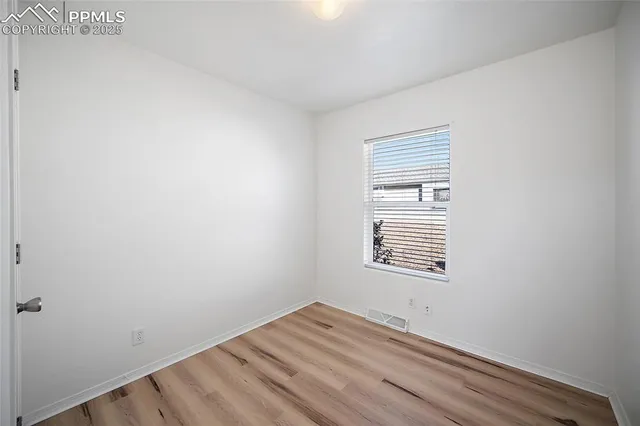 a view of a room that has a window in it