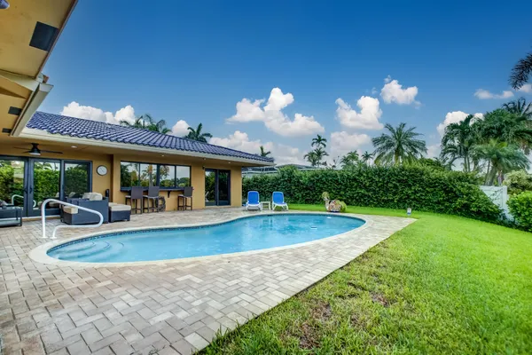 a view of a swimming pool with a patio