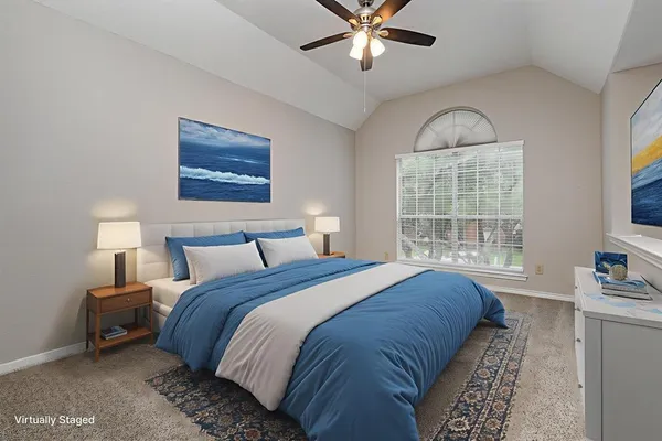 a bedroom with bed and window