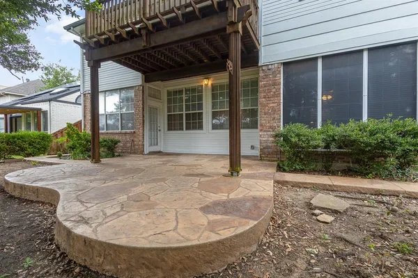 a view of a house with a small yard