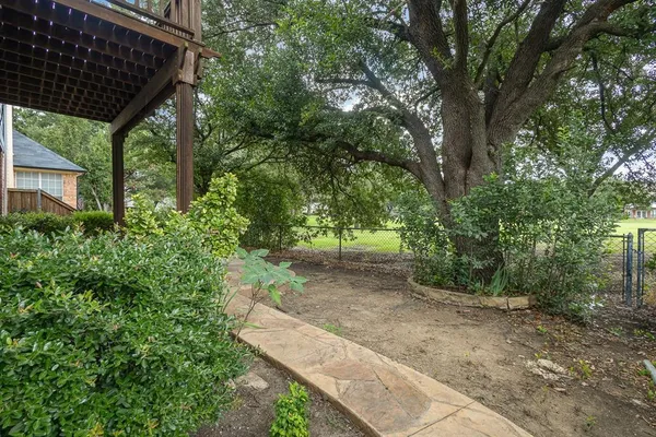 a backyard of a house with lots of green space