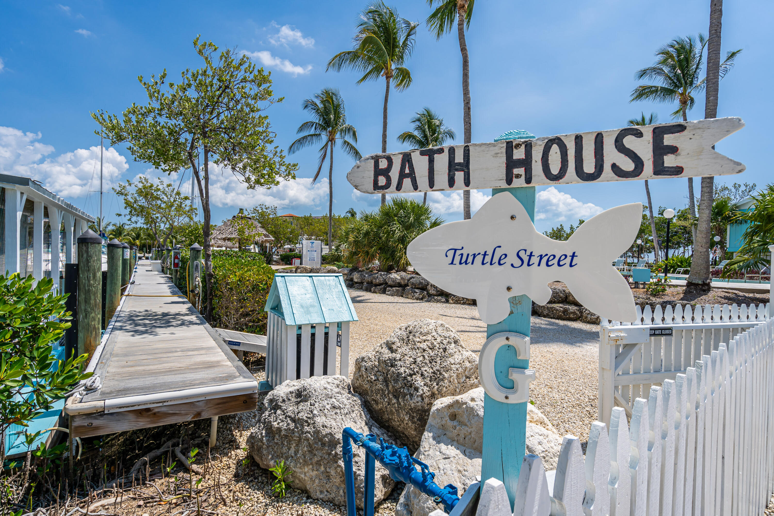 100 Morris Lane, Unit E8 Key Largo, FL 33037 - Photo 10 of 22 a sign on the side of the building