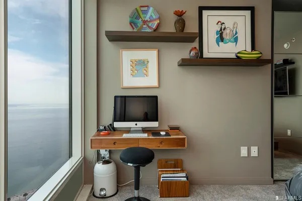 a view of a workspace with furniture