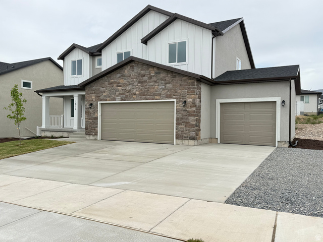 1513 South Deerbrook Road, Unit 256 Santaquin, UT 84655 - Photo 3 of 7 Modern two-story residence featuring a stone and stucco facade