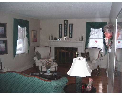 56 Bessemer Street Springfield, MA 01104 - Photo 4 of 15 a living room with furniture and a fireplace