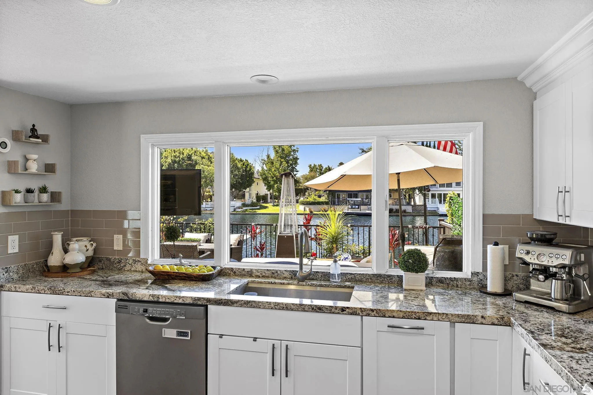 22875 Ridge Rte Lane Lake Forest, CA 92630 - Photo 15 of 54 a kitchen with granite countertop a sink and a white cabinets
