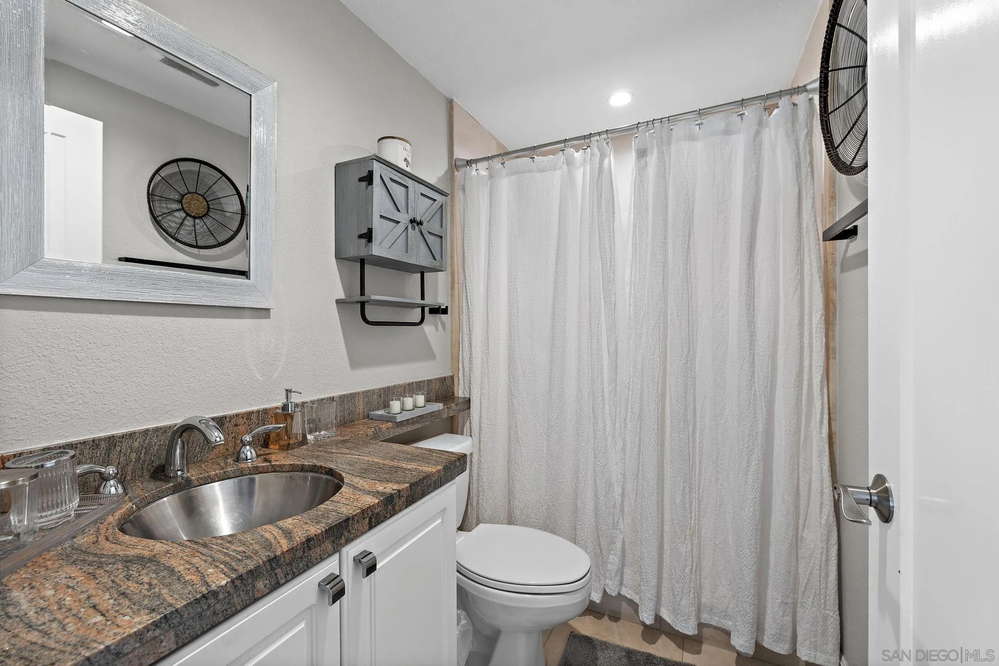 22875 Ridge Rte Lane Lake Forest, CA 92630 - Photo 18 of 54 a bathroom with a granite countertop sink and a toilet