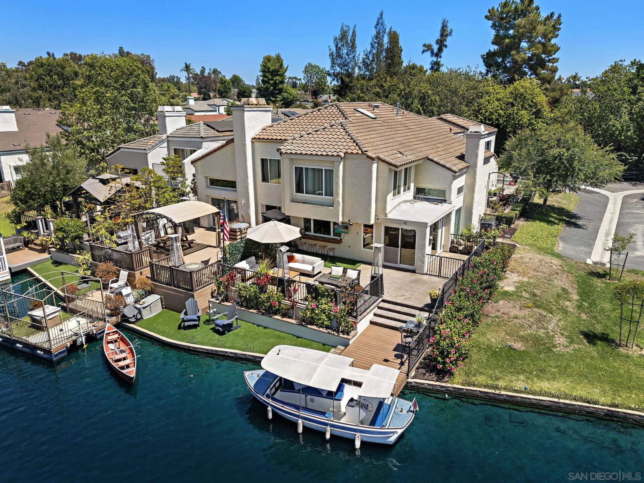 22875 Ridge Rte Lane Lake Forest, CA 92630 - Photo 2 of 54 an aerial view of a house with a garden and lake view