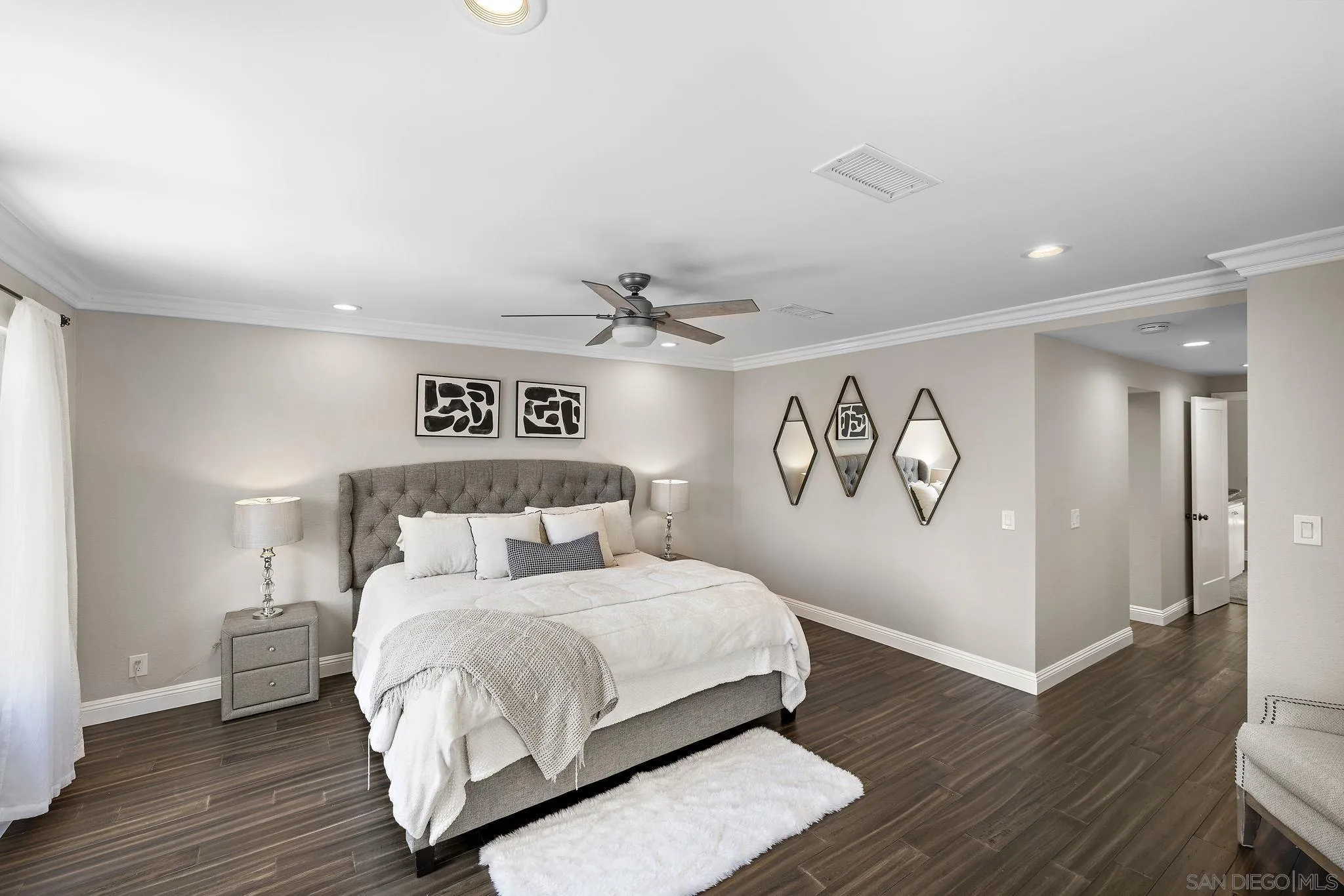 22875 Ridge Rte Lane Lake Forest, CA 92630 - Photo 21 of 54 a bedroom with a large bed and a wooden floor