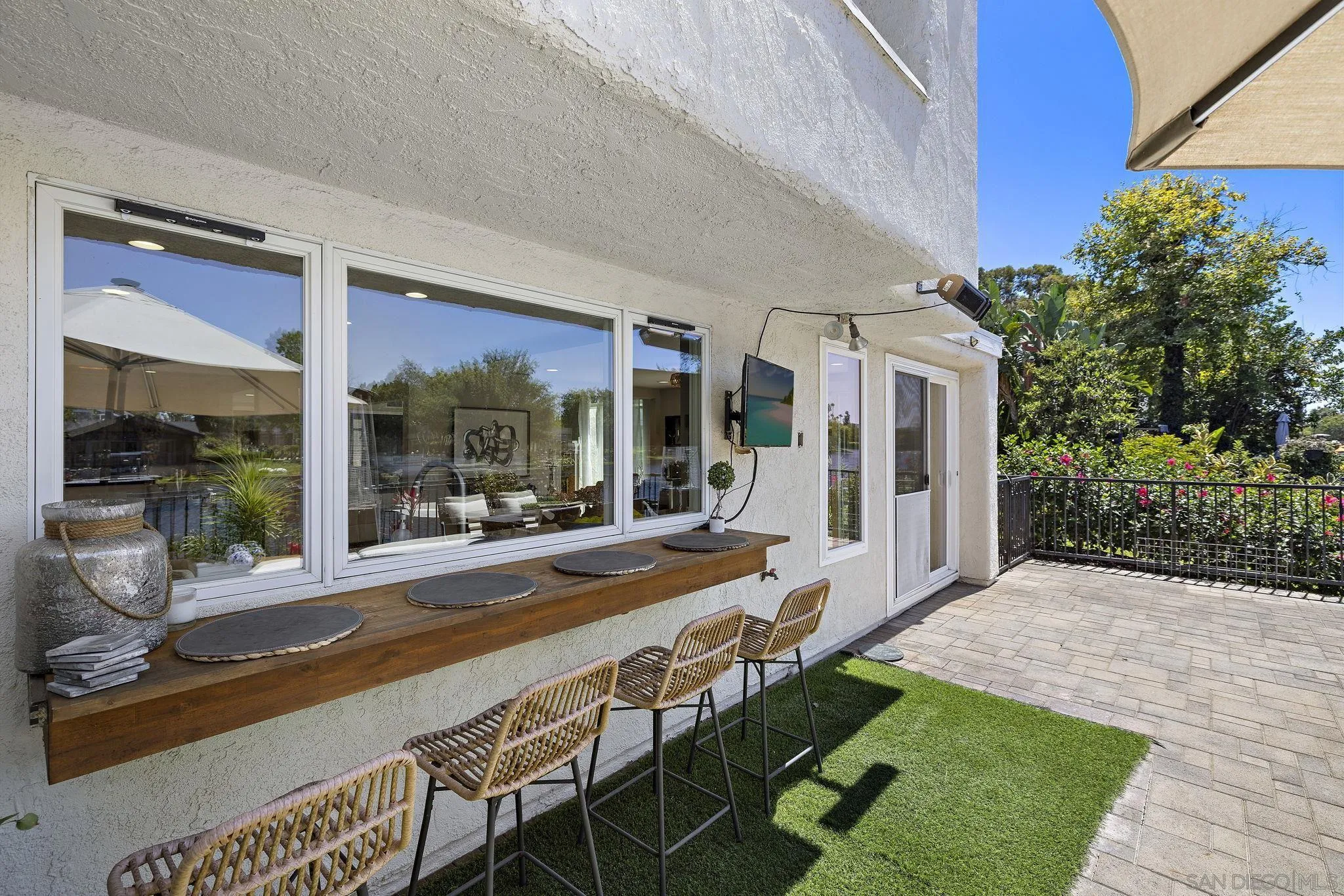 22875 Ridge Rte Lane Lake Forest, CA 92630 - Photo 34 of 54 a porch with a table and chairs and potted plants