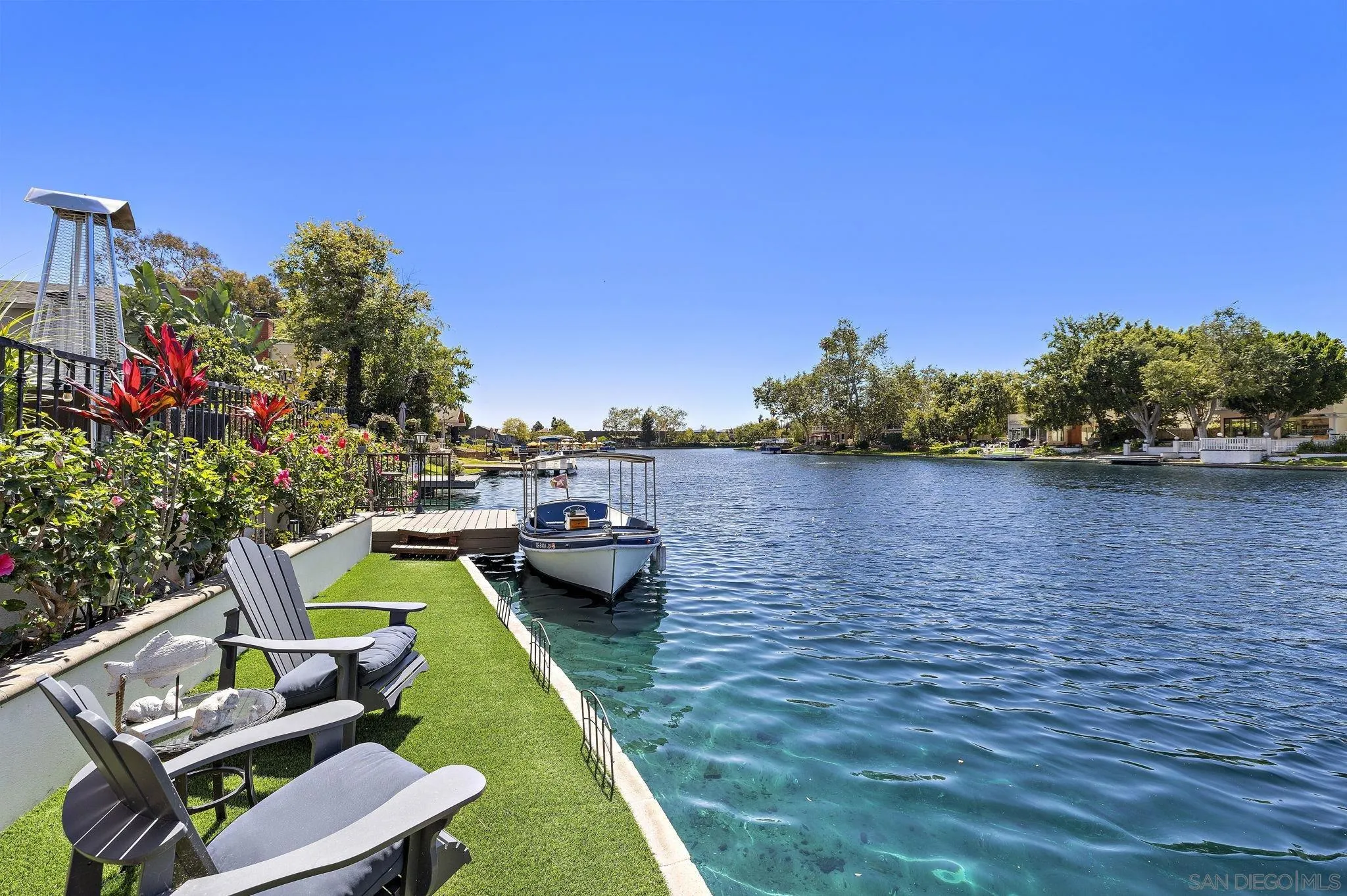 22875 Ridge Rte Lane Lake Forest, CA 92630 - Photo 40 of 54 a view of a lake with couches chairs and a small yard