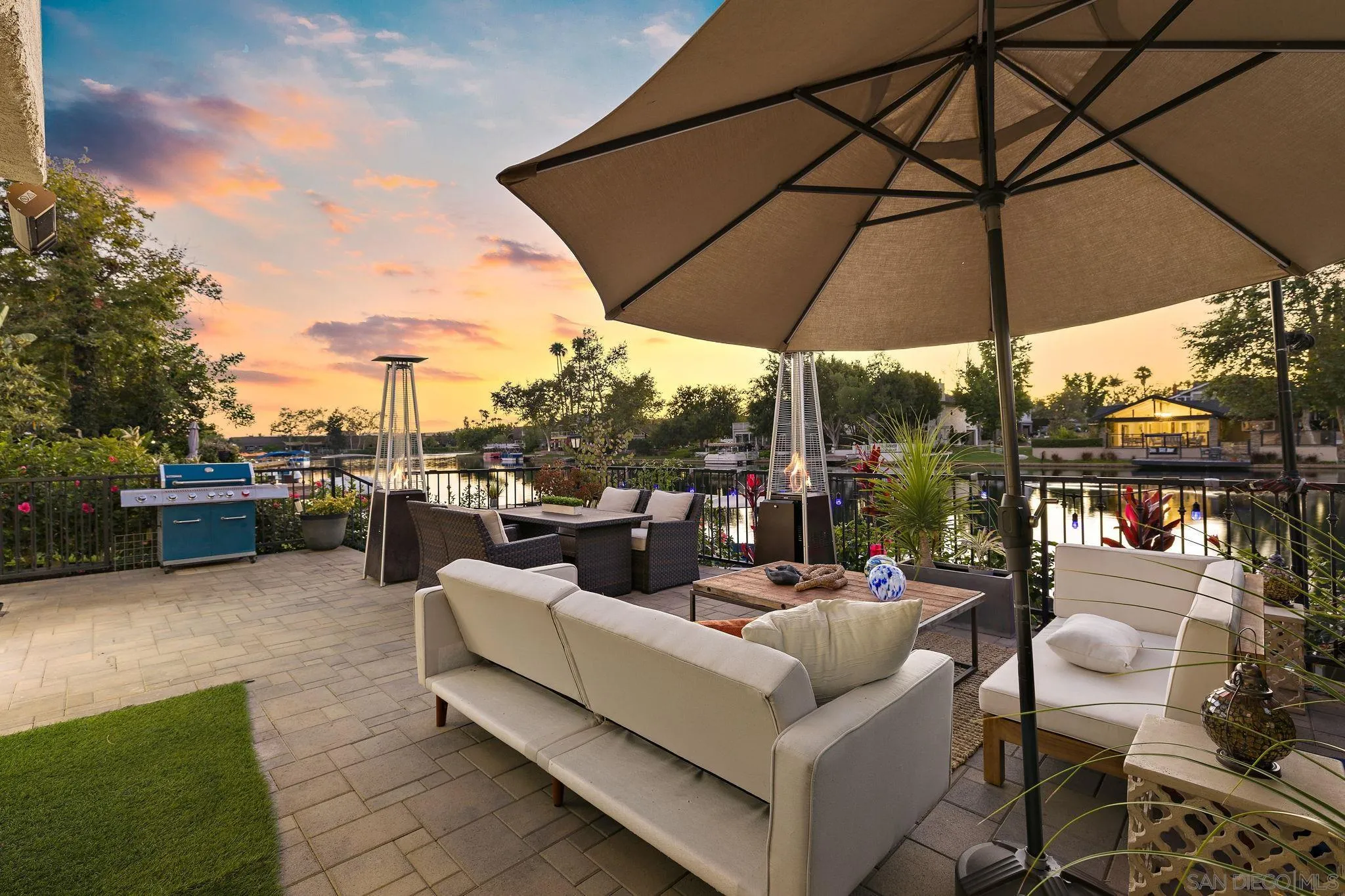 22875 Ridge Rte Lane Lake Forest, CA 92630 - Photo 42 of 54 a view of a roof deck with couches under an umbrella