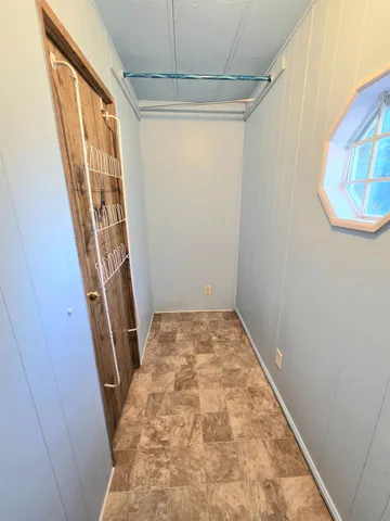 a bathroom with a sink toilet a mirror and shower