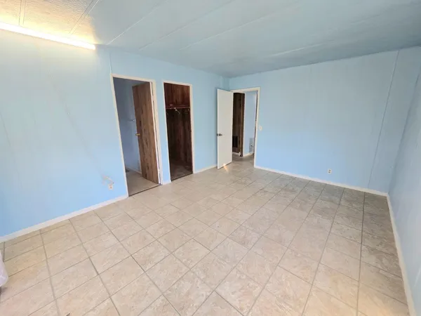a view of a bathroom from a corridor